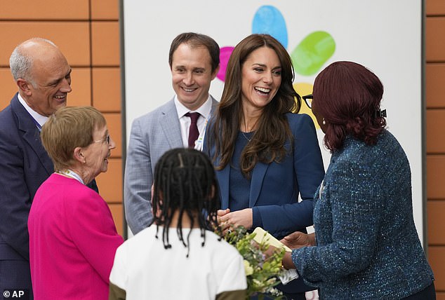 Kate looked delighted to chat to staff after receiving a bunch of flowers