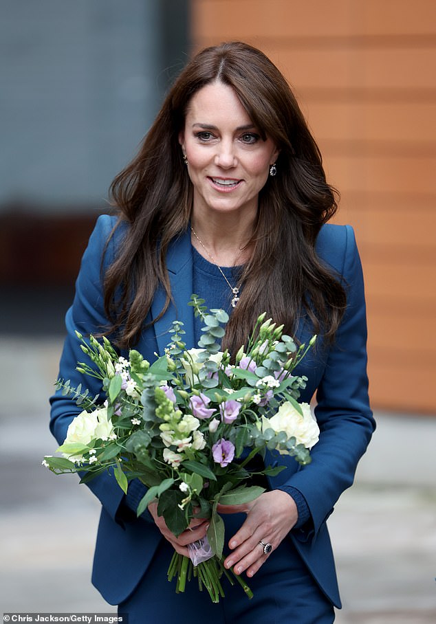The Princess was perfectly coordinated in a dark blue suit with navy shoes, a sapphire necklace and bracelet which match her engagement ring