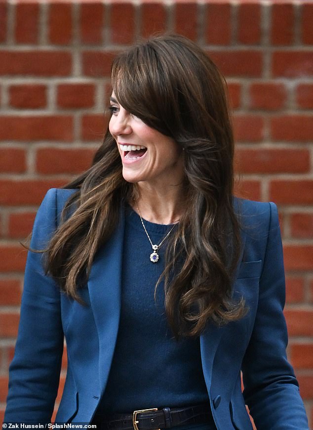 Kate looked sleek with her signature bouncy blow dry and skinny belt
