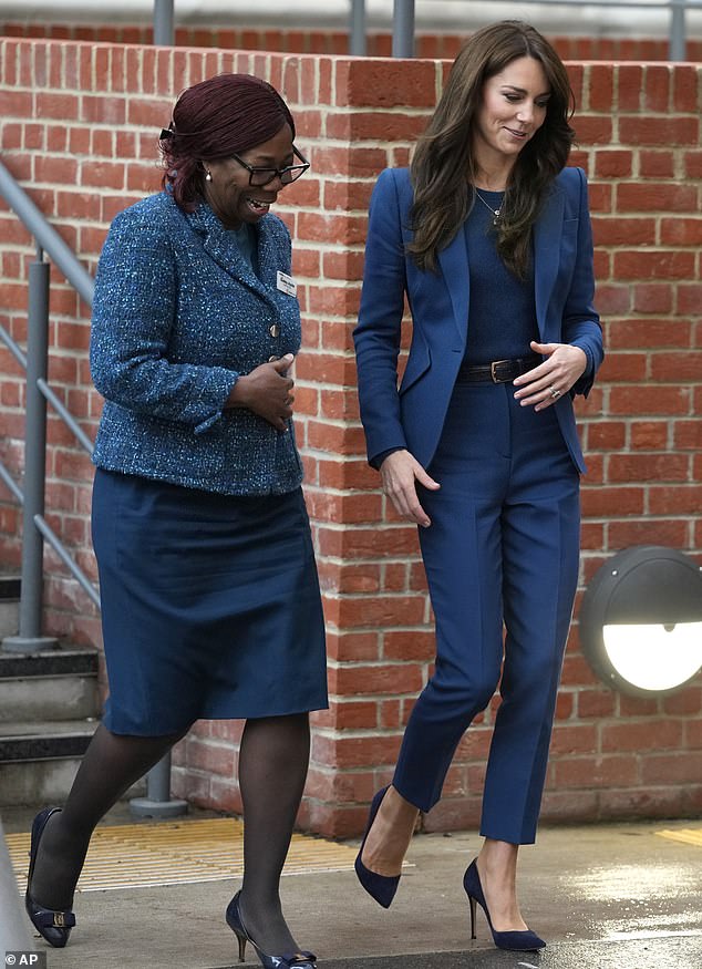 Kate looked at ease and put any royal drama behind her as she walked side-by-side with hospital's chief executive Gubby Ayida.