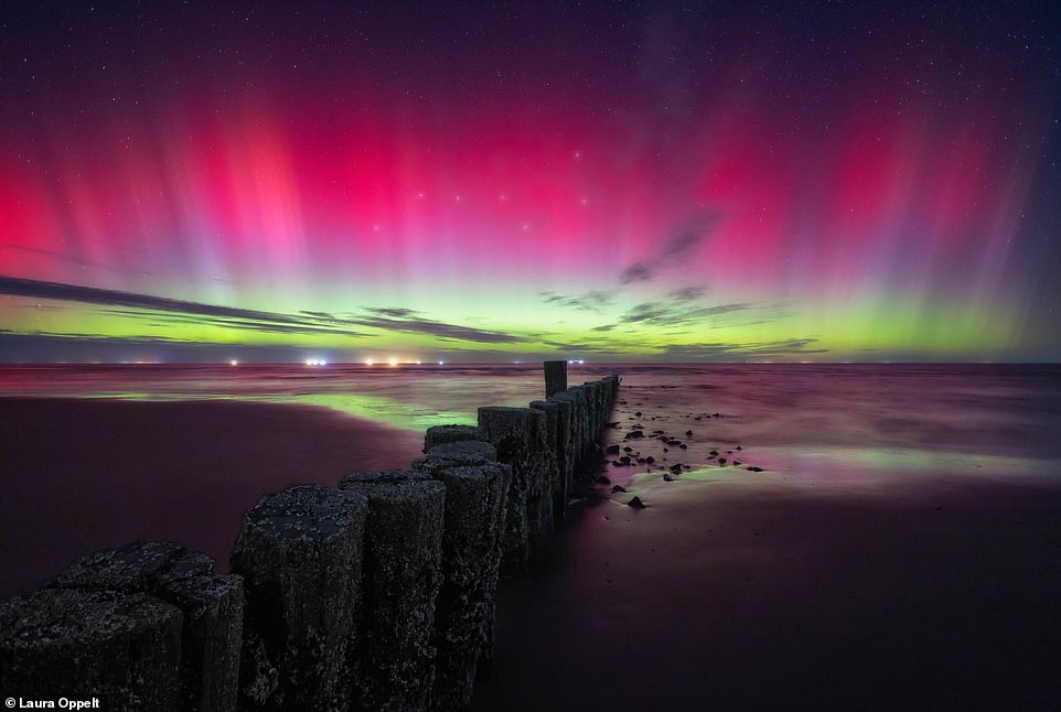 Laura Oppelt took this stunning shot in Wadden Sea National Parks, Germany, and found it hard to believe that she witnessed such a strong aurora show so far south from the Polar circle. She said: 'At a certain point, everything in the sky seemed to explode, and I couldn’t help but scream out loudly on the beach in pure excitement and disbelief'