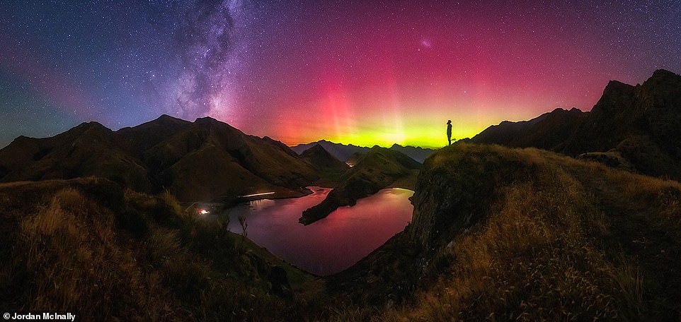 Photographer Jordan McInally took this hypnotic image at Moke Lake, New Zealand, having arrived there, he revealed, just as light beams started to dance across the horizon and the sunlight was fading. He added: 'I spent around five hours up here and had this whole ridge to myself, shooting over 300 frames of all manner of beams and colours as the show was constantly changing'