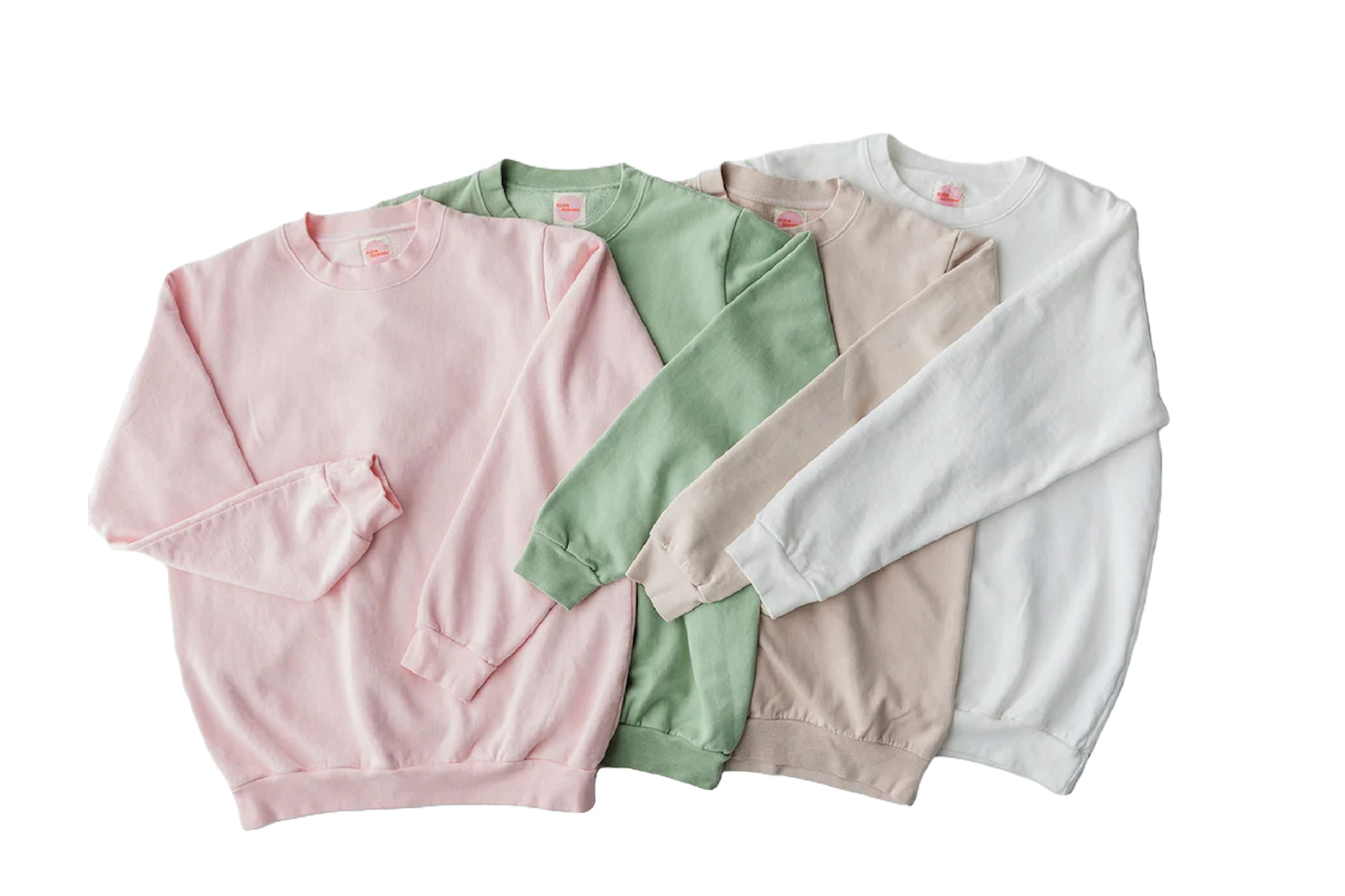 Vier pastellfarbene Sweatshirts