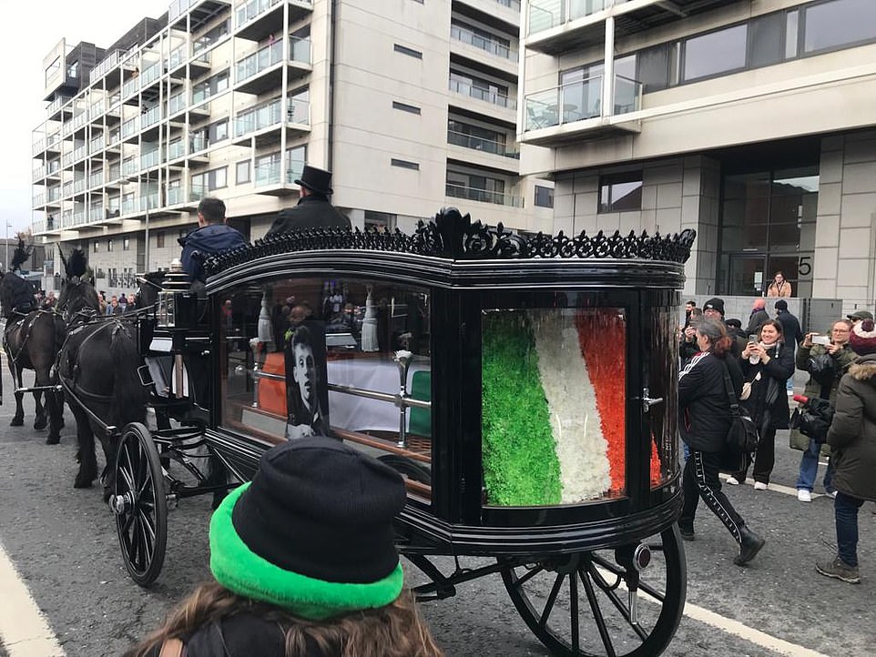 The orange, white and green Irish flag was draped over MacGowan's casket
