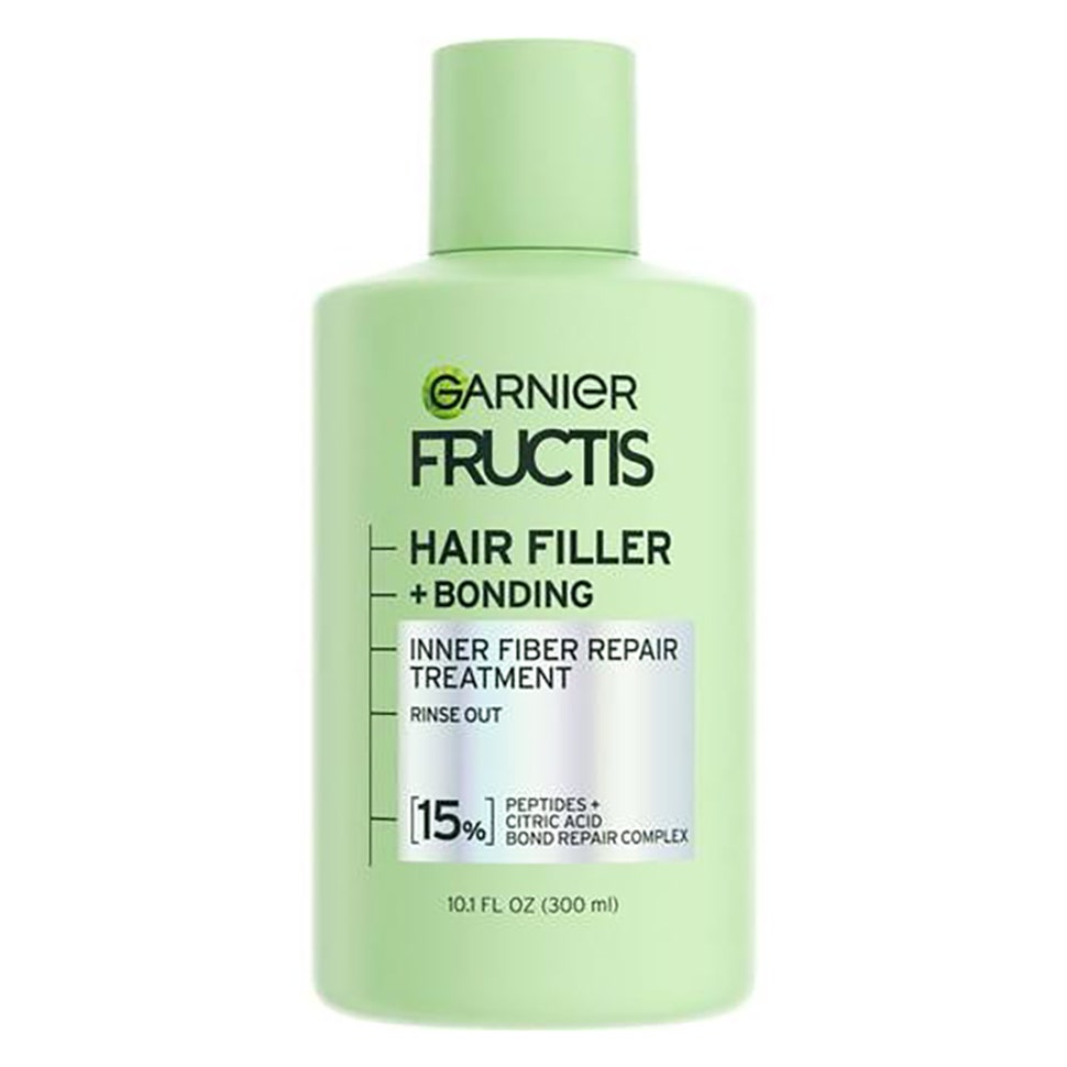 Garnier Fructis Hair Filler + Bonding Inner Fiber Repair Treatment hellgrüne Flasche auf weißem Hintergrund