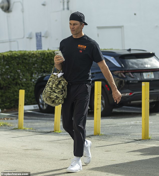 Brady arrived to the gym with a camouflage print bag and his hat worn backwards