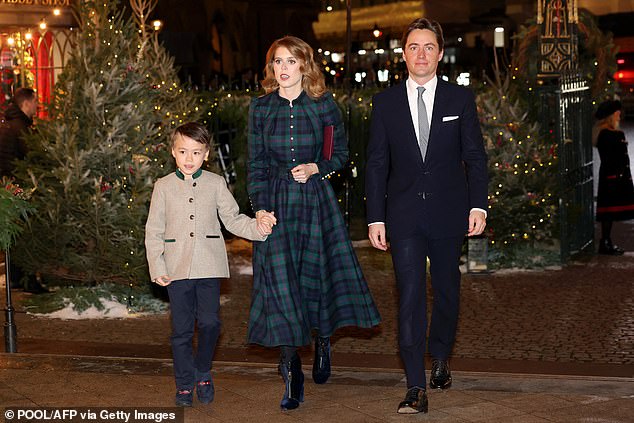 The seven-year-old, pictured holding hands with Beatrice,  who Beatrice refers to as a 'bonus child' is the son of Edoardo Mapelli Mozzi and his ex-fiancee Dara Huang