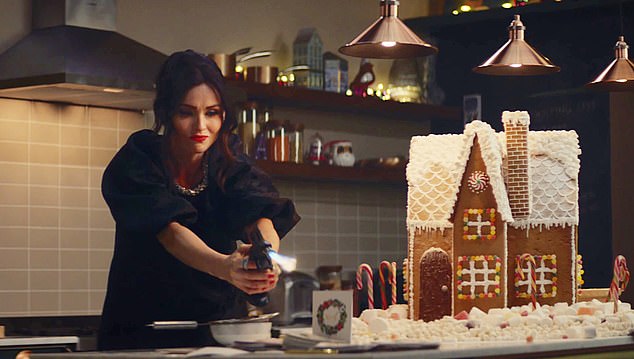 Janet's daughter, Sophie, in this year's M&S Christmas ad - where she¿s let loose with a blowtorch on a gingerbread house and Christmas cards