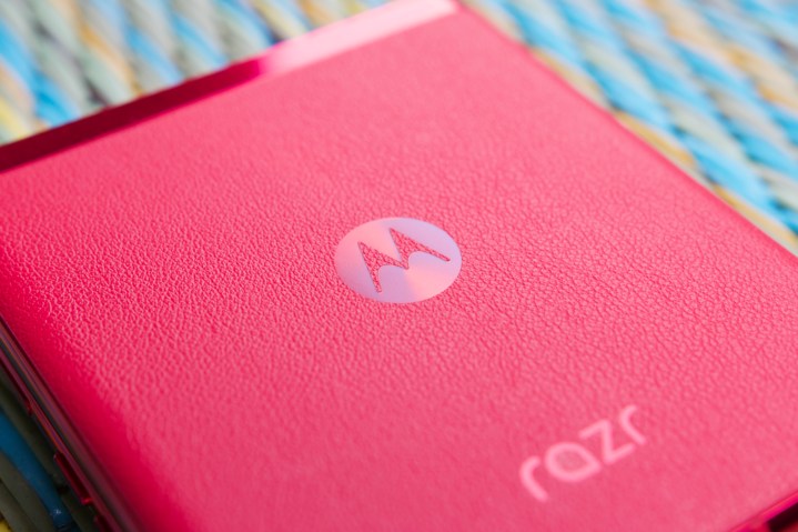 Close-up shot of the Viva Magenta Motorola Razr Plus and its leather back.