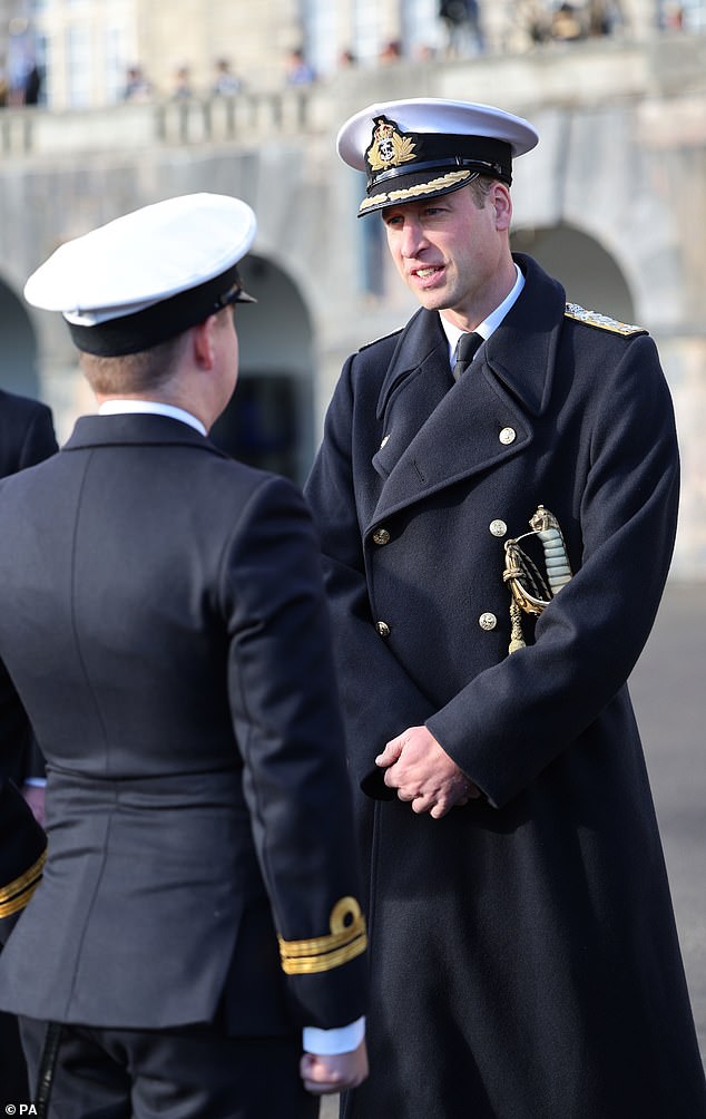 The father-of-three was all smiles during the event, sporting a navy uniform which consisted of a trench-coat with golden buttons, and a naval cap. William also carried a sword