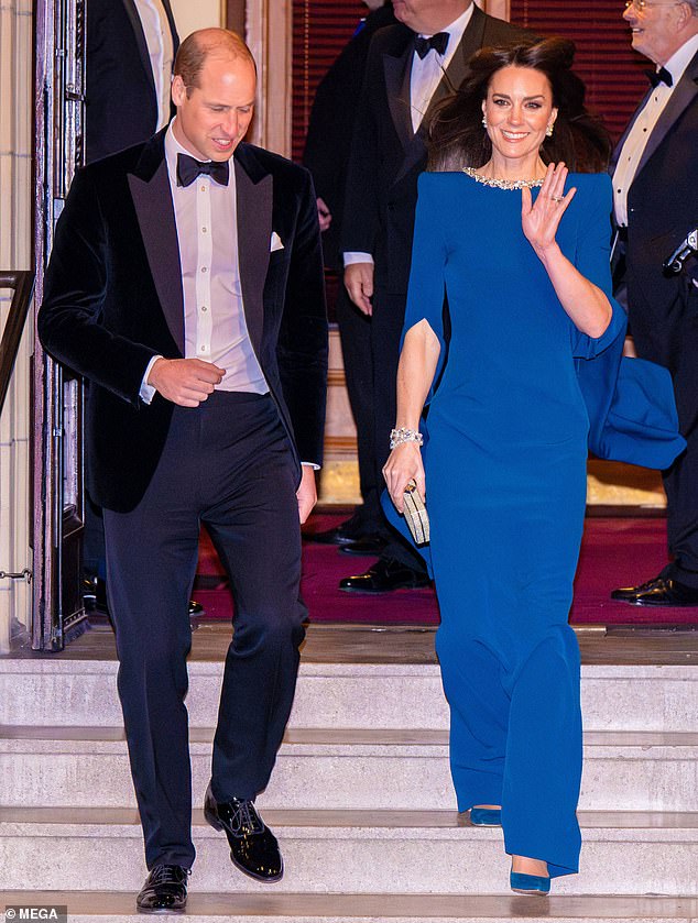 The Princess of Wales waves in her striking blue dress as she steps out alongside Prince William at the show in London