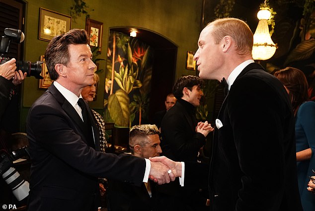 Prince William speaks to Rick Astley at last night's glamorous evening event at the Royal Albert Hall