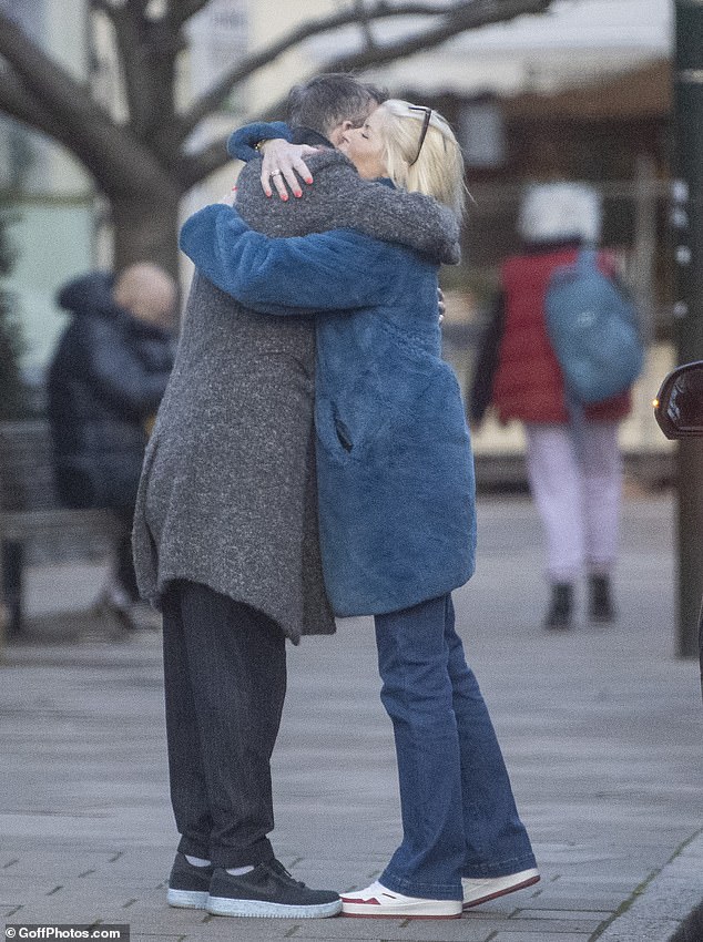 Television production guru Dan, 48, was seen hugging Holly's mum Linda as they left the restaurant