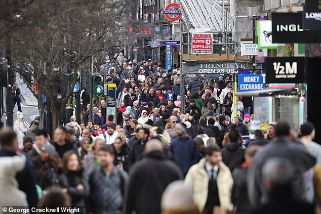 Christmas shoppers descend on a busy Oxford Street in central London on Saturday ahead of December 25