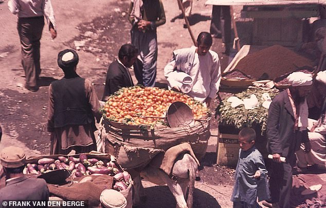 A market scene in Kabul. Frank recalls seeing 'horse carts, donkeys, pedestrians, [and] playing kids' during his time in the city