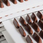 Schokoladenkriege, während italienische Handwerker gegen den Schweizer Riesen kämpfen