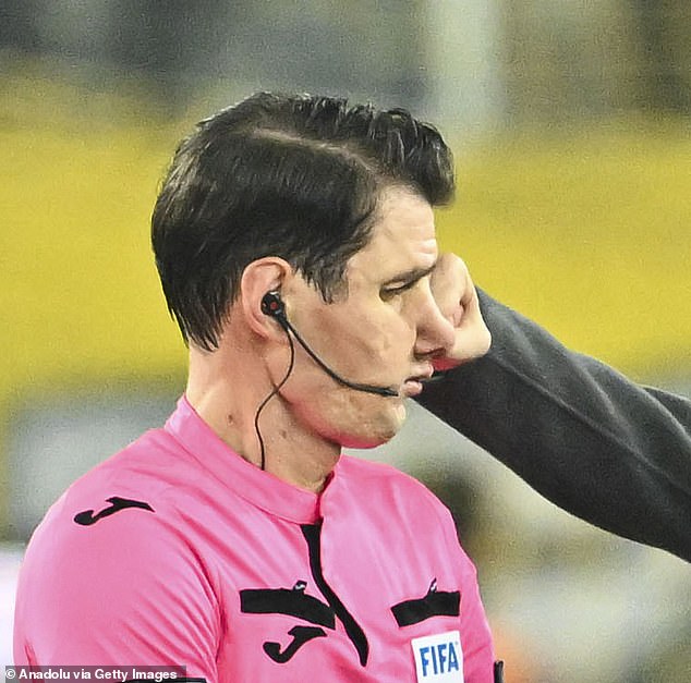 A Turkish referee (pictured) who was punched by a club president and then kicked in the head on the ground last night has said his assailant threatened to kill him