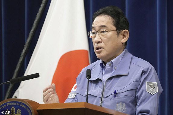 Japan's Prime Minister Fumio Kishida speaks at a press conference in Tokyo Tuesday, Jan. 2, 2024. A series of powerful earthquakes hit western Japan, damaging buildings, vehicles and boats, with officials warning people in some areas on Tuesday to stay away from their homes because of a risk of more strong quakes. (Kyodo News via AP)