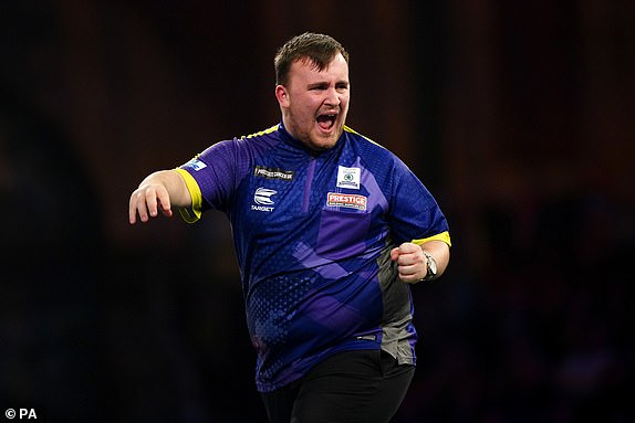 Luke Littler reacts during his match against Brendan Dolan (right) on day fourteen of the Paddy Power World Darts Championship at Alexandra Palace, London. Picture date: Monday January 1, 2024. PA Photo. See PA story DARTS World. Photo credit should read: Zac Goodwin/PA Wire.RESTRICTIONS: Use subject to restrictions. Editorial use only, no commercial use without prior consent from rights holder.