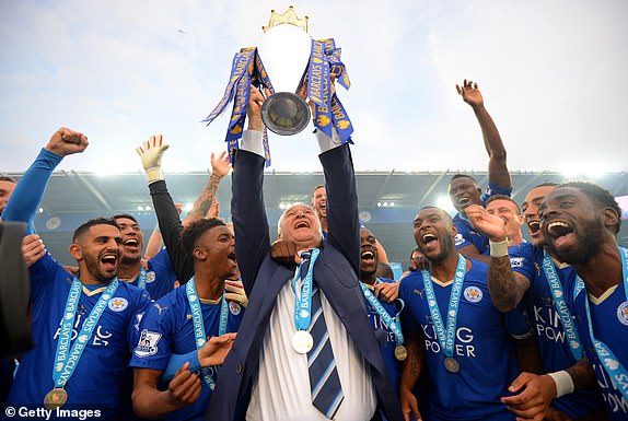 LEICESTER, ENGLAND - MAY 07:  Claudio Ranieri Manager of Leicester City lifts the Premier League Trophy as players celebrate the season champions after the Barclays Premier League match between Leicester City and Everton at The King Power Stadium on May 7, 2016 in Leicester, United Kingdom.  (Photo by Michael Regan/Getty Images)