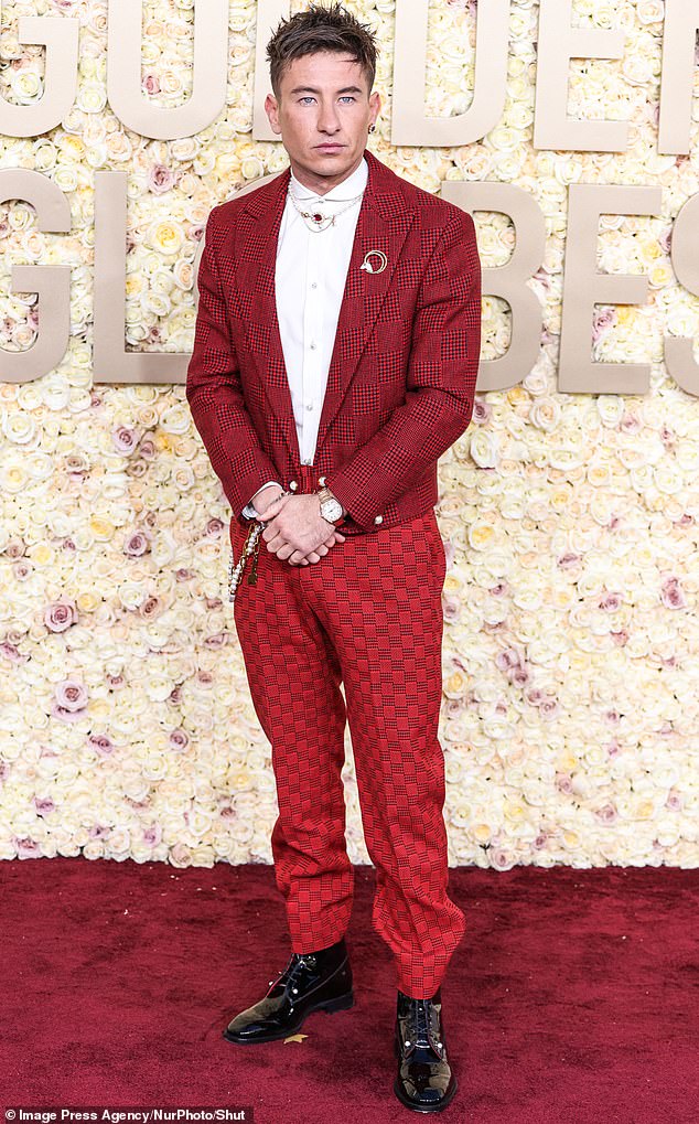 Pictured: Irish actor Barry Keoghan, 31, wore a red-and-black checked suit to the Golden Globes on Sunday