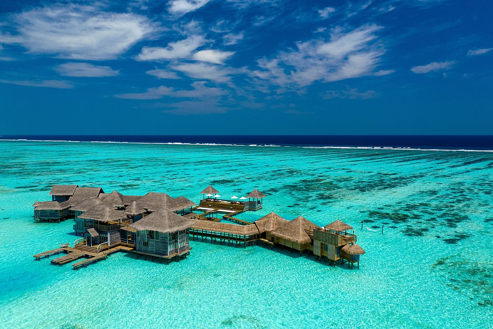 THE PRIVATE RESERVE, GILI LANKANFUSHI, MALDIVES: According to Elite Traveler, this water villa promises a 'true castaway experience' with the only neighbours being 'those in the coral reefs below'. Part of Gili Lankanfushi, it is set 1,700ft (518m) away from the main resort and spread over 18,300 sq ft (1,700 sq m), making it the largest standalone water villa in the world, Elite Traveler claims. The duplex master suite comprises two bedrooms and a guest room while outdoor areas boast an infinity pool and a sea-level sundeck 'complete with catamaran nettings that allow direct access to the crystal-clear waters'. There is also a gym, private spa, cinema room and waterslides. Stays start from $13,775 (£10,835) per night