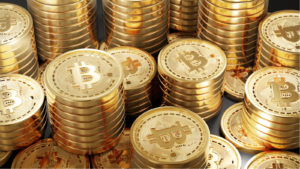 Stapel von goldenen Bitcoin-Tokens gestapelt. Bitcoin-Preisvorhersagen.