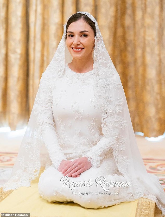 Anisha looked every inch the bride-to-be in a long-sleeved white gown with a lace-trimmed veil, which she paired with pearl earrings