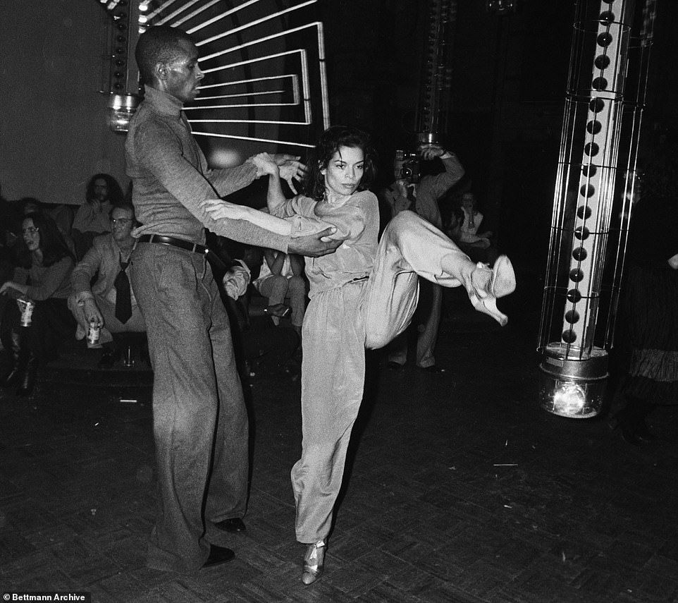 Jagger is seen engaging in some high-stepping as she dances with the actor-model Jacques during the same outing to the cocaine-fueled dancefloors of Studio 54