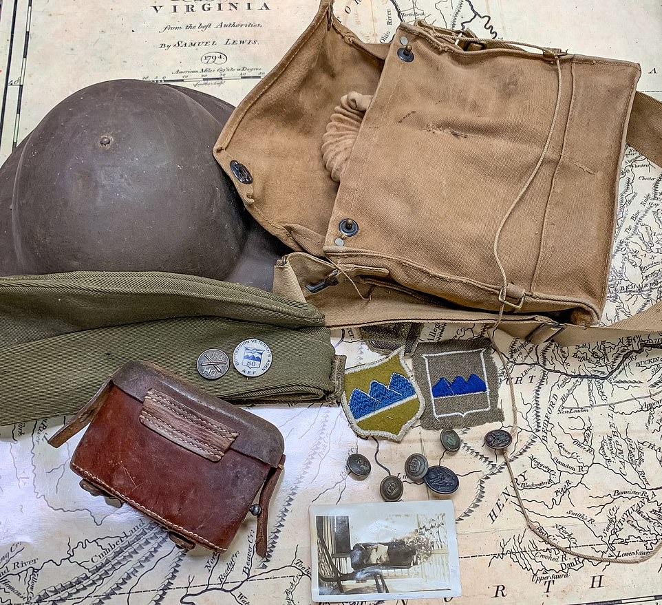 In the lower left drawer of the book cabinet, Bryan found a World War I gas mask, a German binocular case filled with German infantry buttons, patches and war mementos belonging to the father of the elderly lady who last lived there