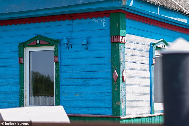 Ukrainian village houses have distinctive regional features like this home in the Chernehiv region with its bright colours and distinctive decorations. Slava and Borys worry that these styles may be lost in the post-war reconstruction