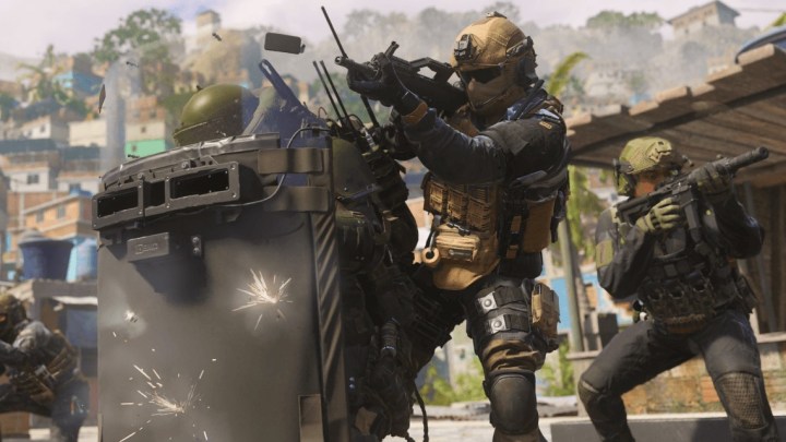 Auf einem Werbebild für Call of Duty: Modern Warfare 3 verstecken sich Soldaten hinter einem Schutzschild.