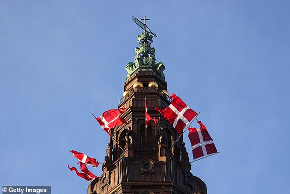 COPENHAGEN, DENMARK - JANUARY 14: Flags of Denmark are seen on the Tower of Christiansborg Palace on January 14, 2024 in Copenhagen, Denmark. On January 14th, Her Majesty The Queen steps down as Queen of Denmark and entrusts the throne to His Royal Highness The Crown Prince. (Photo by Sean Gallup/Getty Images)