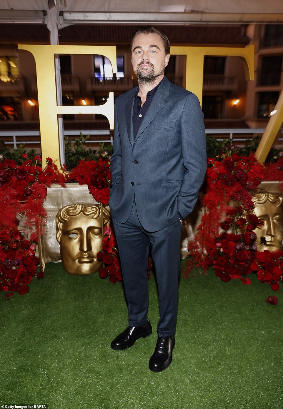 Leonardo DiCaprio donned a sleek, blue suit as well as a darker button up that was worn underneath at the event