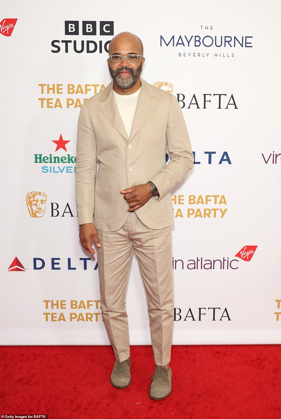 Jeffrey Wright opted for a tan-colored suit as well as a white shirt and for a final touch, slipped into a pair of tan shoes that were secured with laces