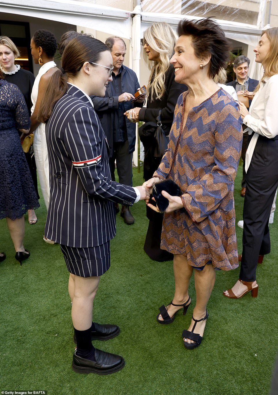 Bella Ramsey was spotted shaking hands with Joyce Pierpoline as the pair met up at the festivities which was held outside