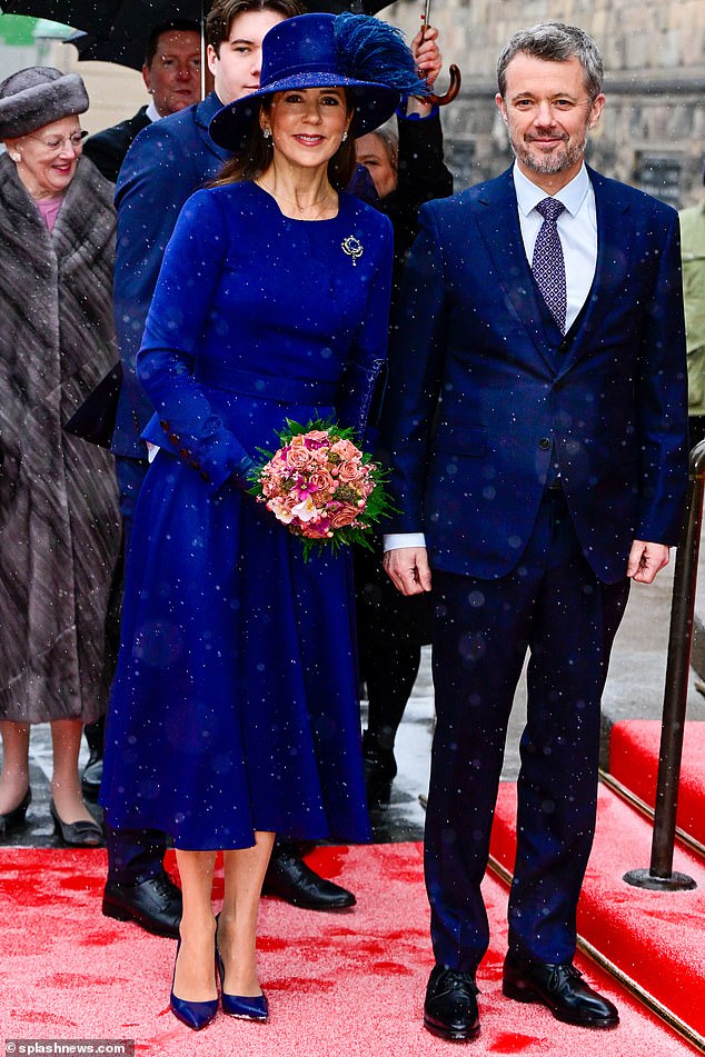 Mary showed off her new status in a royal blue dress with matching accessorises
