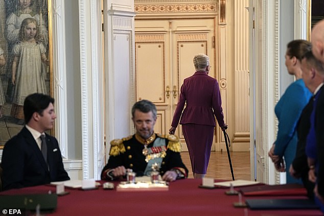 Queen Margrethe leaves the Council of State meeting after signing a declaration of abdication at Christiansborg Castle