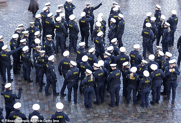 Police officers gather before the ride of the royals from Amalienborg Castle to Christiansborg Castle