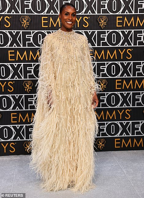 Issa Rae leaned into the accidental cosplay theme of the evening by taking a leaf out of Big Bird's book and sporting a yellow feathered ensemble