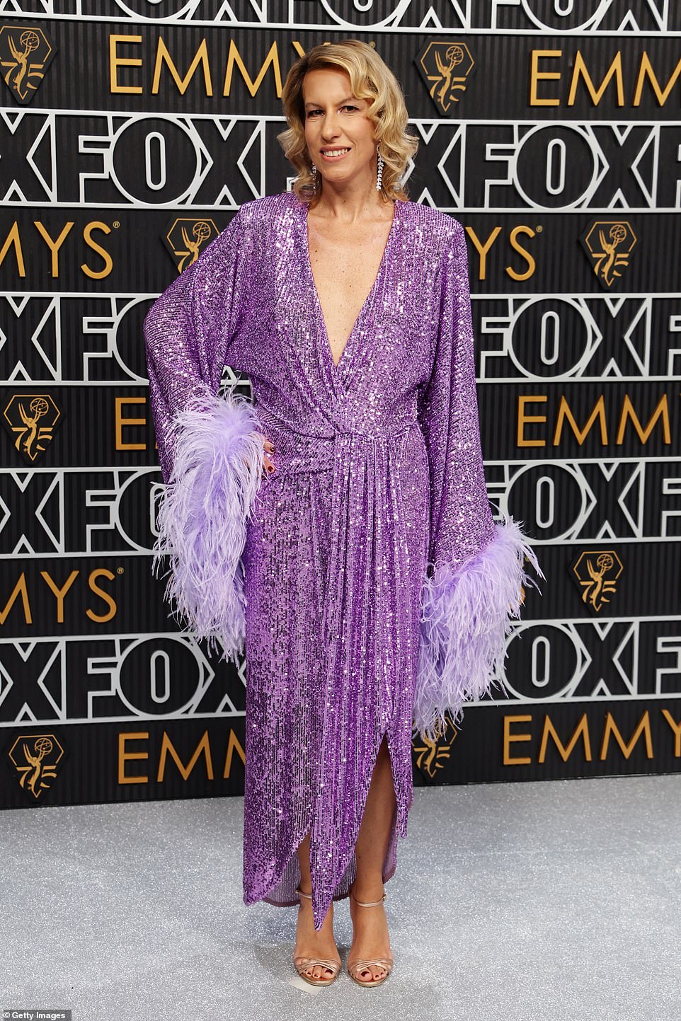 Francesca Zocchi's purple sequin-and-feathered number made her look like a substitute host for a game show - or perhaps a wannabe show girl with her sights set on a Las Vegas stage