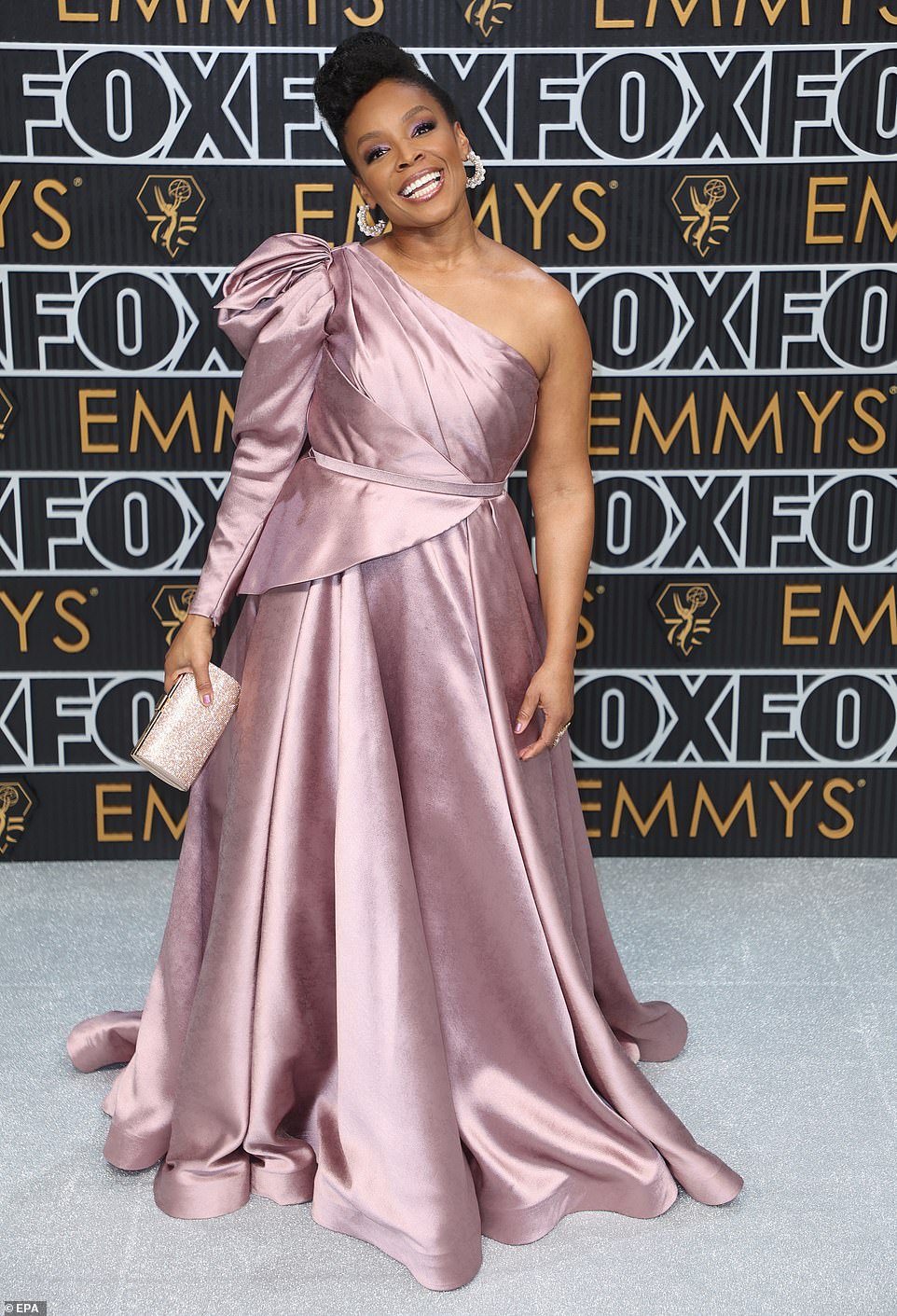 Comedian Amber Ruffin's pale pink gown featured far too much fabric and did little to flatter her figure, while the color made it look like something off the sale rack at David's Bridal