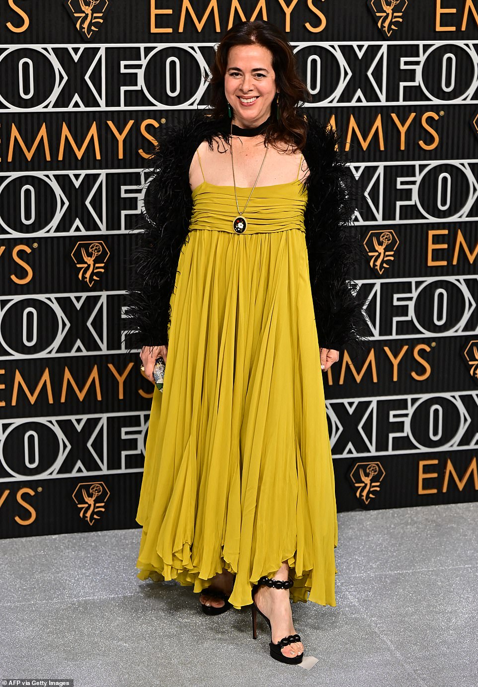 Poor color choice seemed to be something of a theme for the evening, as proven by writer Neena Beber, whose baggy mustard-colored frock was one of the many fashion fails of the night