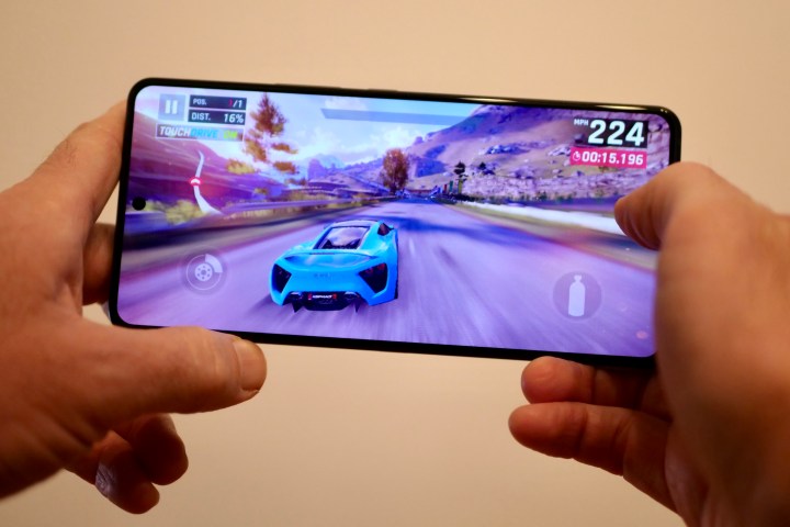 A person playing a game on the Asus ROG Phone 8 Pro.
