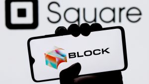 Blocklogo auf einem Hintergrund mit ehemals quadratischem Logo.  SQ-Aktie.