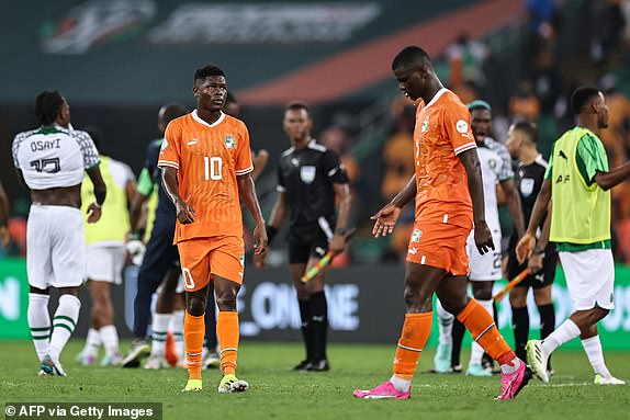 Ivory Coast's forward #10 Karim Konate (C) and Ivory Coast's defender #2 Ousmane Diomande react after losing at the end of the Africa Cup of Nations (CAN) 2024 group A football match between Ivory Coast and Nigeria at the Alassane Ouattara Olympic Stadium in Ebimpe, Abidjan, on January 18, 2024. (Photo by FRANCK FIFE / AFP) (Photo by FRANCK FIFE/AFP via Getty Images)