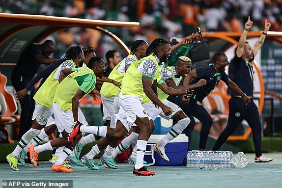 Nigeria's players celebrate after winning at the end of the Africa Cup of Nations (CAN) 2024 group A football match between Ivory Coast and Nigeria at the Alassane Ouattara Olympic Stadium in Ebimpe, Abidjan, on January 18, 2024. (Photo by FRANCK FIFE / AFP) (Photo by FRANCK FIFE/AFP via Getty Images)