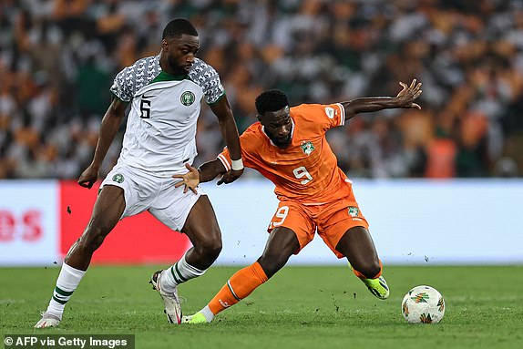 Nigeria's defender #6 Semi Ajayi (L) fights for the ball with Ivory Coast's forward #9 Jonathan Bamba during the Africa Cup of Nations (CAN) 2024 group A football match between Ivory Coast and Nigeria at the Alassane Ouattara Olympic Stadium in Ebimpe, Abidjan, on January 18, 2024. (Photo by FRANCK FIFE / AFP) (Photo by FRANCK FIFE/AFP via Getty Images)