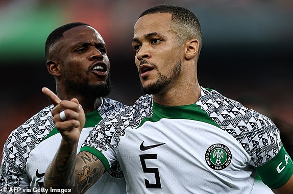 Nigeria's defender #5 William Troost-Ekong (R) celebrates after shooting a penalty and scoring his team's first goal during the Africa Cup of Nations (CAN) 2024 group A football match between Ivory Coast and Nigeria at the Alassane Ouattara Olympic Stadium in Ebimpe, Abidjan, on January 18, 2024. (Photo by FRANCK FIFE / AFP) (Photo by FRANCK FIFE/AFP via Getty Images)