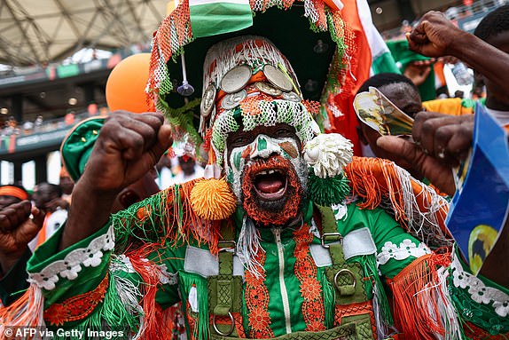 TOPSHOT - An Ivory Coast's supporter gestures ahead of the Africa Cup of Nations (CAN) 2024 group A football match between Ivory Coast and Nigeria at the Alassane Ouattara Olympic Stadium in Ebimpe, Abidjan, on January 18, 2024. (Photo by FRANCK FIFE / AFP) (Photo by FRANCK FIFE/AFP via Getty Images)